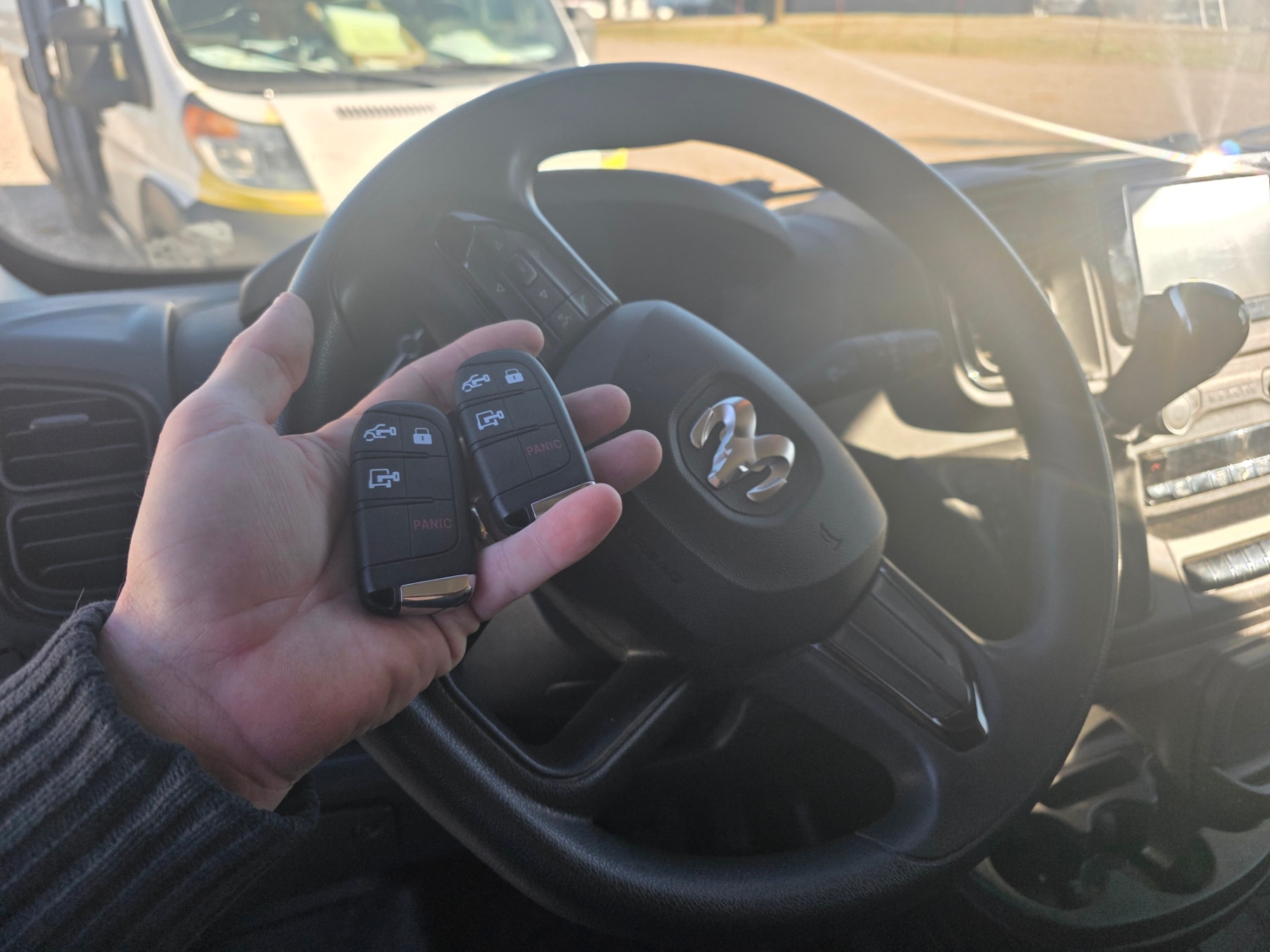Car key fob at steering wheel