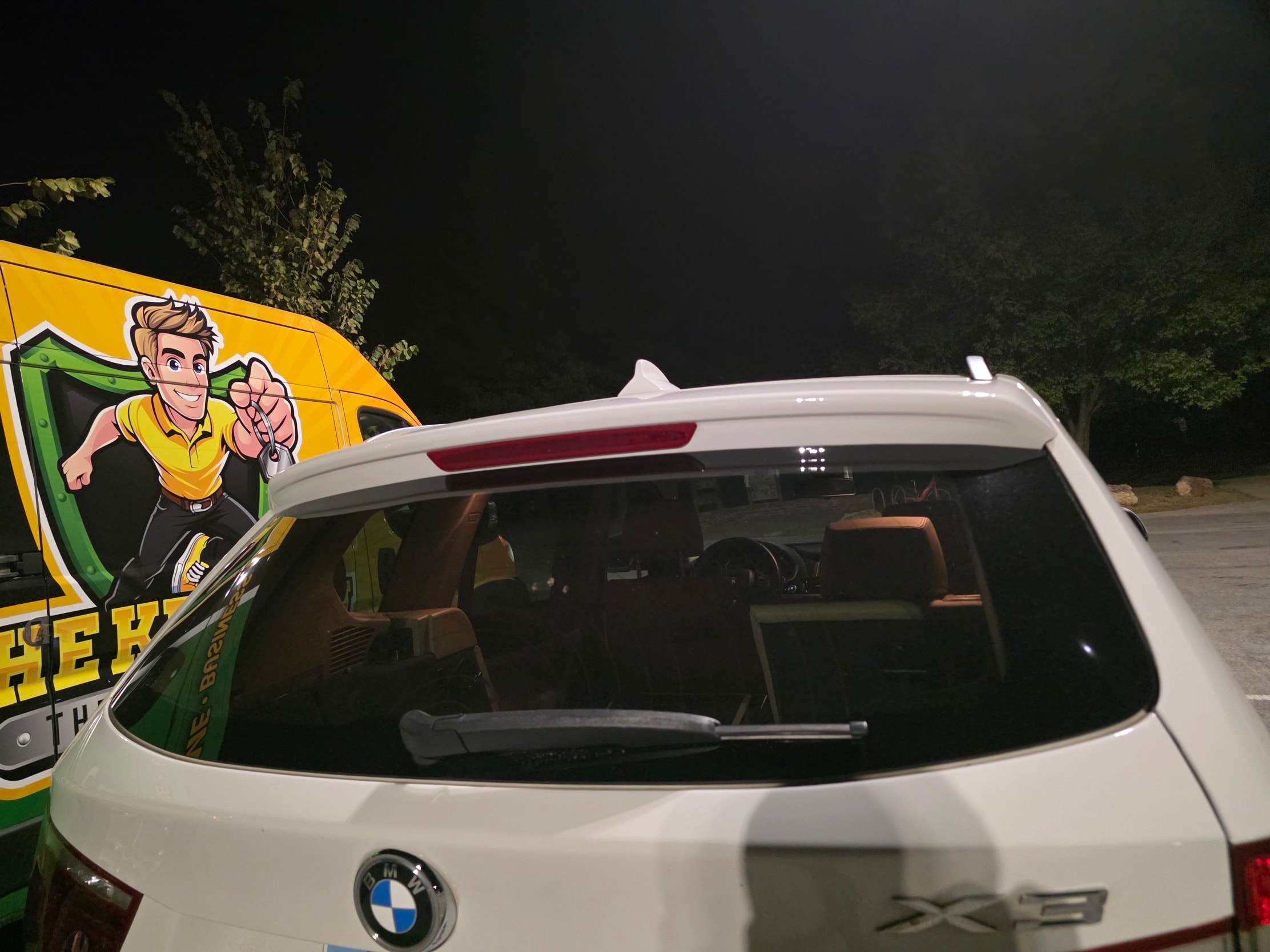 White BMW with service van