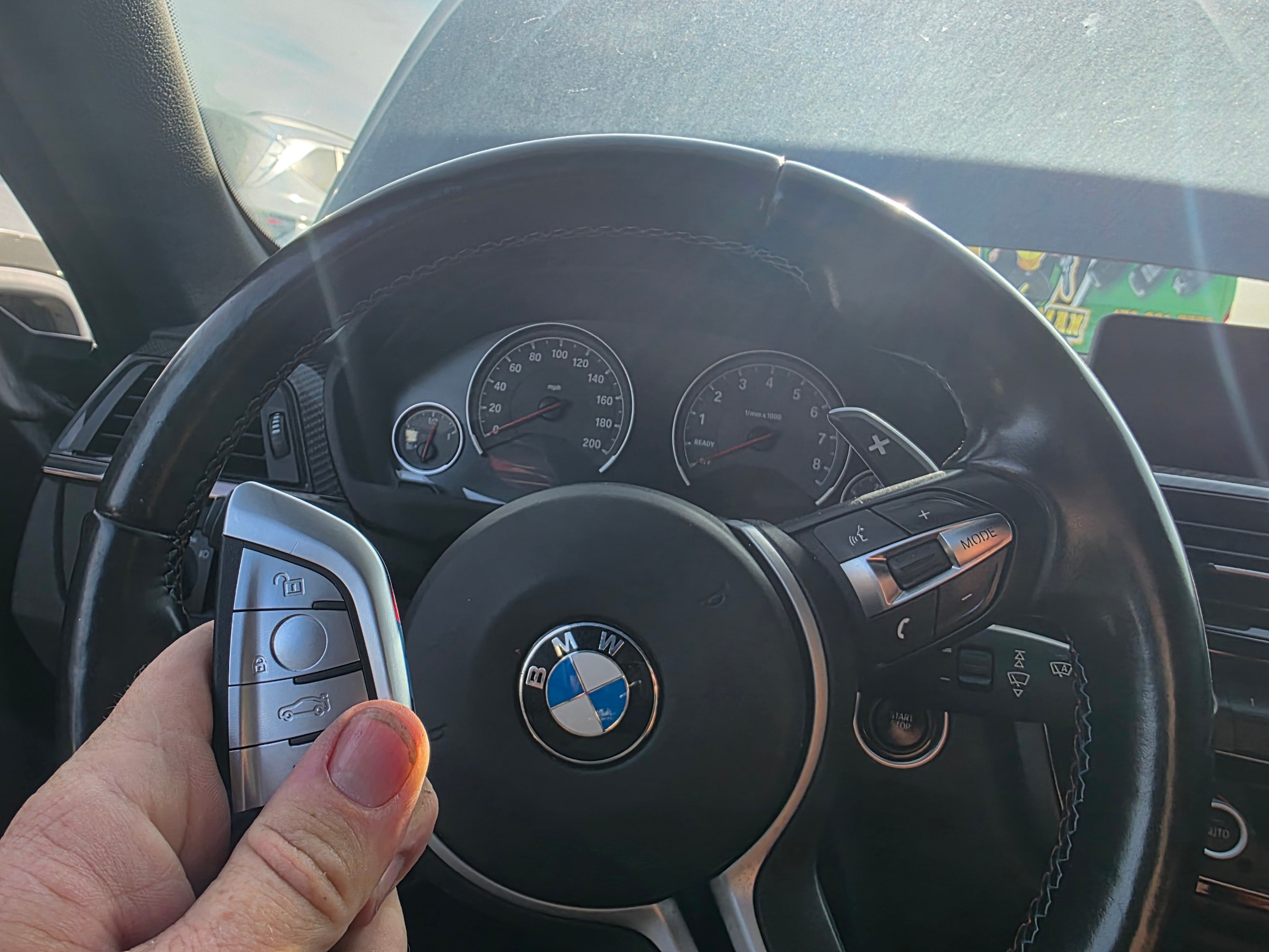 BMW key fob at steering wheel